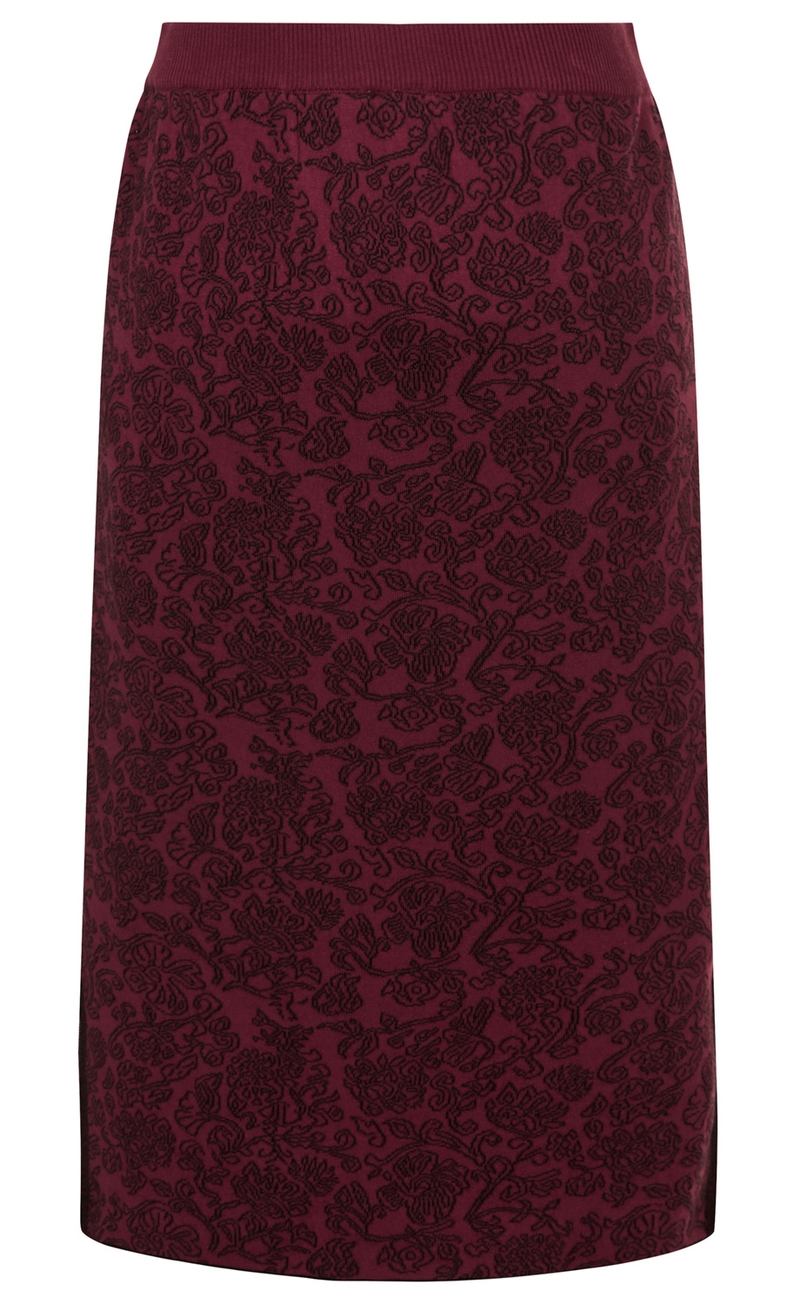 Baumwoll-Rock in Bordeauxrot mit schwarzem floralen Muster, elastischem Bund, knielang, gerade geschnitten, weicher Stoff, elegante Optik, keine sichtbaren Verschlüsse oder Verzierungen.