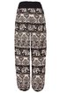 Locker geschnittene Hose mit elastischem Bund und Bündchen in Schwarz und Weiß, gemustert mit Elefanten und floralen Ornamenten, durchgehendes Design, gerade geschnittene Beine