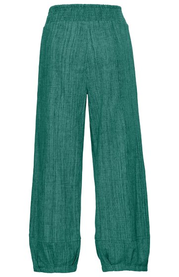 Grüne weite Hose mit hohem Bund, glatter Oberfläche, langen geraden Beinen, elastischem Bund oben und Bündchen unten