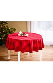 Runder Esstisch mit rotem Tischdeckenmuster, mittlere Karos, glatte Oberfläche, weiße Tischbeine, mit weihnachtlicher Dekoration aus Sternkerze, Tannenzweigen und kleinen Schalen mit Dekoobjekten