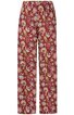 Locker geschnittene lange Hose in Dunkelrot mit floralem Muster in Gelb und Weiß, elastischer Bund ohne sichtbare Verschlüsse