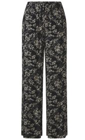 Schwarze Viskose-Hose mit weitem Bein und elastischem Bund, beiges florales Muster mit Blättern und Ranken, leichter, fließender Stoff.